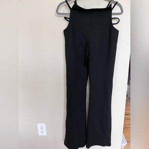 I.AM.GIA Black pants flared , body con , cut out detail . Excellent condition.